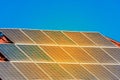 Solar panels on the roof of a building against a blue sunny sky Royalty Free Stock Photo