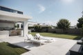 Solar panels on the roof of a modern house. Beautiful house with white kitchen, large windows and a terrace. ing