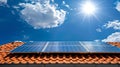 Solar Panels on a Rooftop Under a Clear Blue Sky with Bright Sun. Sustainable Energy Concept. Clean Electricity Royalty Free Stock Photo