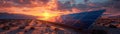 Solar panels silhouetted against a vibrant sunset sky Royalty Free Stock Photo