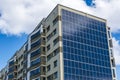 Solar panels on the wall of a multi-storey building. Renewable solar energy Royalty Free Stock Photo