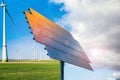 Solar panels and wind generators under blue sky . Royalty Free Stock Photo