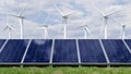 Solar panels and wind turbine on the blue sky background Royalty Free Stock Photo