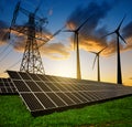 Solar panels with wind turbines and electricity pylon Royalty Free Stock Photo