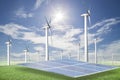 Solar panels,wind turbines on green grass with blue sky background,natural Energy. Royalty Free Stock Photo