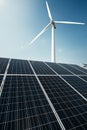 Solar panels and a windmill generate electricity from the sun Royalty Free Stock Photo