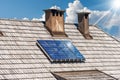 Solar Panels on a Wooden Roof of a Chalet - Renewable Energies Concept Royalty Free Stock Photo