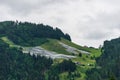 Solar park, photovoltaic power station located on a mountain slope in the Alps. Royalty Free Stock Photo