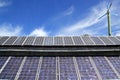 Solar plates and windmill under blue sky Royalty Free Stock Photo