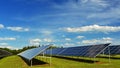 Solar power plant - concept for electricity and ecological industry. High energy prices. Beautiful landscape and sunny day with Royalty Free Stock Photo