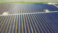 Solar power plant. Many blue panels of large solar power plant Aerial drone view