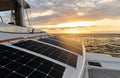 Solar powered catamaran at sunset