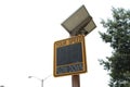 solar powered electronic yellow and black your speed sign on wood post. p Royalty Free Stock Photo