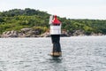Solar powered navigational light by an island Royalty Free Stock Photo