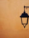 solar powered street lamp on orange background Royalty Free Stock Photo