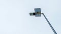 Solar-powered street lamp with a white background. Royalty Free Stock Photo