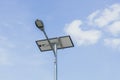 Solar powered street light on blue sky background with clouds Royalty Free Stock Photo