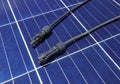 Solar PV Connectors Male and Female laid on Solar Panel Surface Royalty Free Stock Photo