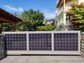 Solar sliding gate with solar panels at house driveway Royalty Free Stock Photo