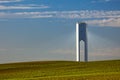 Solar Tower with rays - thermo-solar power - blue sky and green