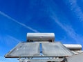 Solar water heater installed on tile roof of house for environmentally Royalty Free Stock Photo