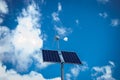 Solar and wind powered lamp. Photovoltaic panel and windmill mounted on the street lamp Royalty Free Stock Photo