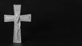 Isolated ornate religious cross with a flower on a dark background. Moment of grief at the end of a life. Last farewell. Sympathy Royalty Free Stock Photo