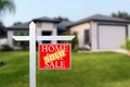 Sold Home For Sale Real Estate Sign in Front of Beautiful New House. Royalty Free Stock Photo