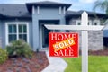 Sold Home For Sale Real Estate Sign in Front of Beautiful New House. Royalty Free Stock Photo