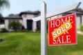 Sold Home For Sale Real Estate Sign in Front of Beautiful New House. Royalty Free Stock Photo