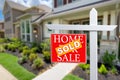 Sold Home For Sale Real Estate Sign in Front of Beautiful New House. Royalty Free Stock Photo