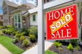 Sold Home For Sale Real Estate Sign in Front of Beautiful New House. Royalty Free Stock Photo