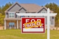 Sold Home For Sale Real Estate Sign in Front of New House Royalty Free Stock Photo