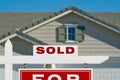 Sold Home For Sale Real Estate Sign and House Royalty Free Stock Photo