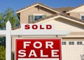 Sold Home For Sale Real Estate Sign and House Royalty Free Stock Photo
