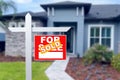 Sold Home For Sale Sign in Front of New House. Royalty Free Stock Photo