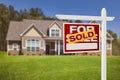 Sold Home For Sale Sign in Front of New House Royalty Free Stock Photo