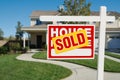 Sold Home for Sale Sign and House Royalty Free Stock Photo