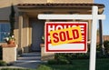 Sold Home For Sale Sign and House Royalty Free Stock Photo