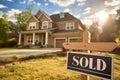 Sold sign in front of a suburban house Royalty Free Stock Photo