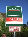 Sold subject to contract sign. cottages & garage sold sign Royalty Free Stock Photo