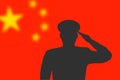 Solder silhouette on blur background with China flag