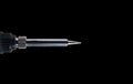 Solderer tip for wire soldering over black Royalty Free Stock Photo