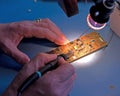 Soldering electronic components. Royalty Free Stock Photo