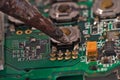 Soldering iron and circuit board Royalty Free Stock Photo