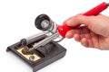 Soldering iron in hand Royalty Free Stock Photo