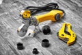A soldering iron or welding machine for plastic polypropylene pipes with attachments and scissors is ready for soldering