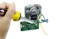 Soldering iron with tin on a motor circuits. Royalty Free Stock Photo