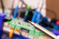 Soldering process on a green PCB closeup Royalty Free Stock Photo