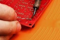 Soldering process on a printed circuit board Royalty Free Stock Photo